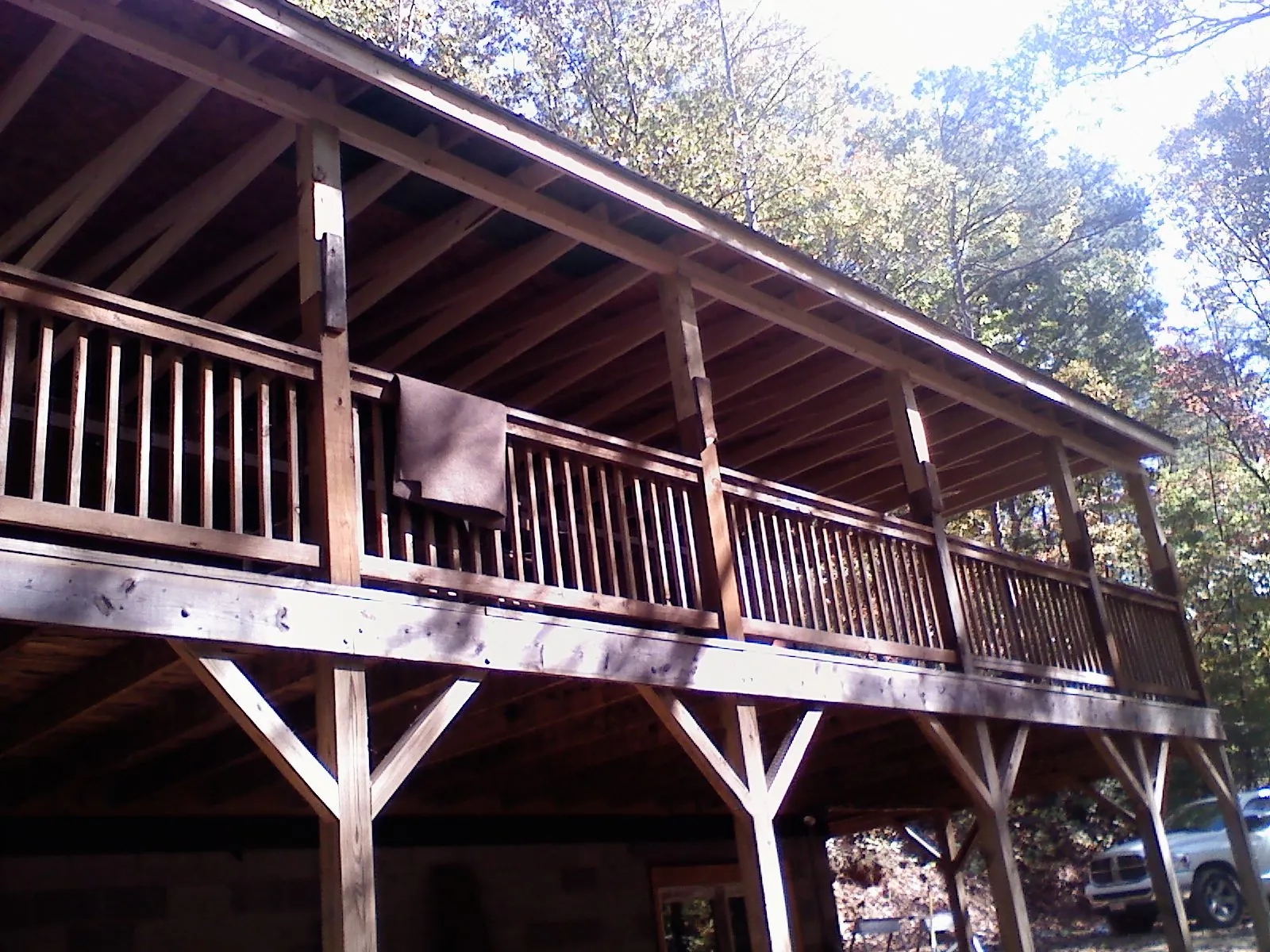 Timber framing under a new elevated porch and deck — Roof Leak Repair in Isle by Roofing Brothers
